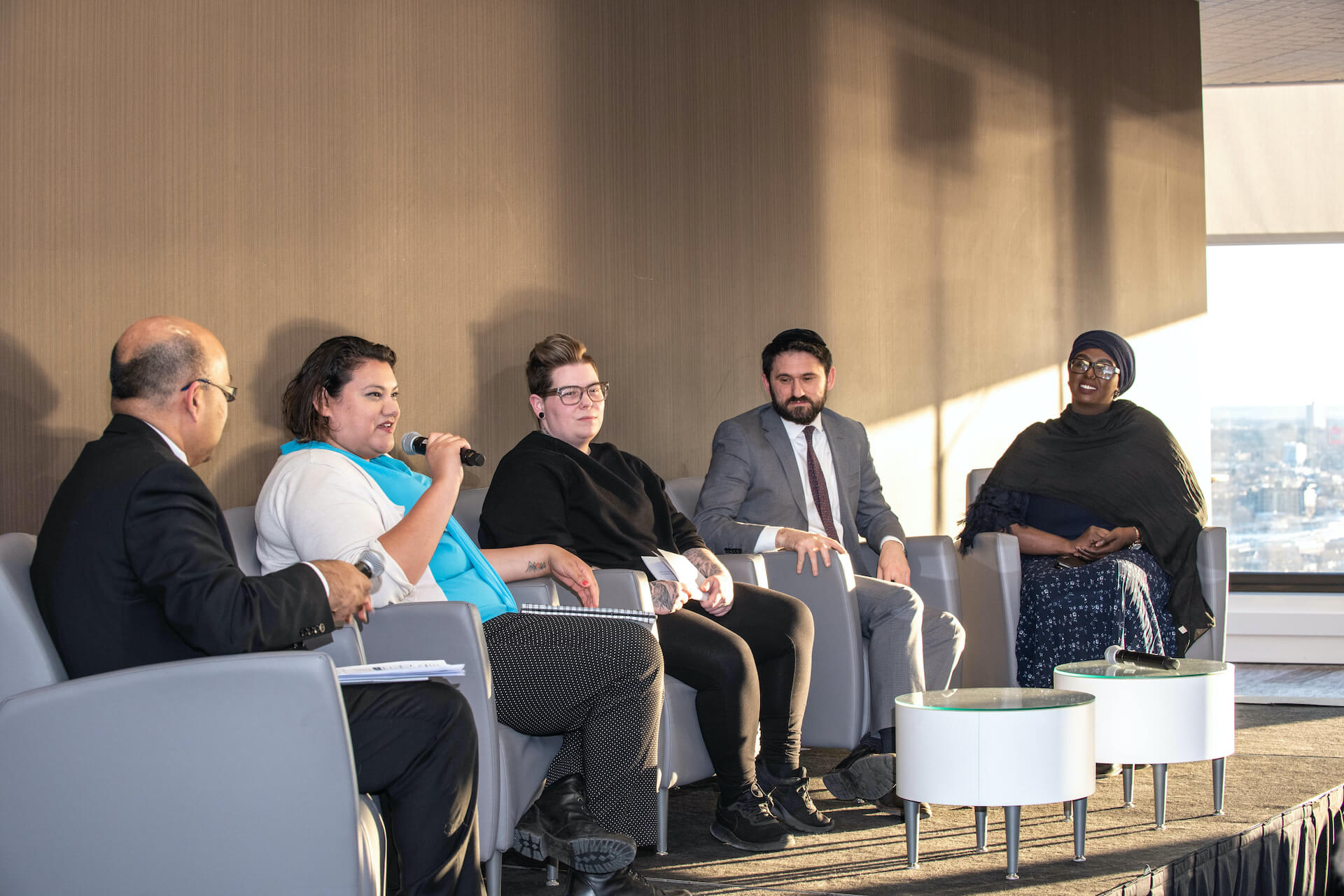 photo of five people in a panel discussion